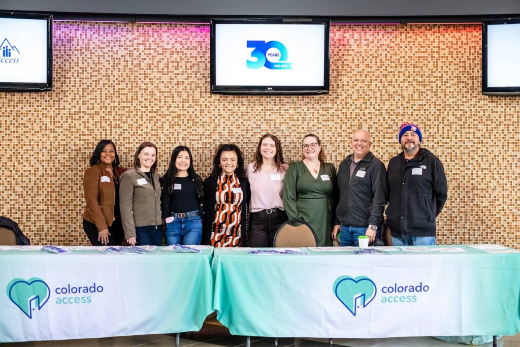 A group of Colorado Access employees smiling for a photo.